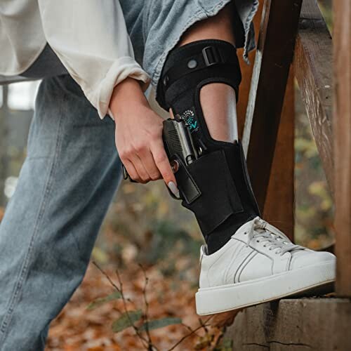 Person using an ankle holster outdoors.